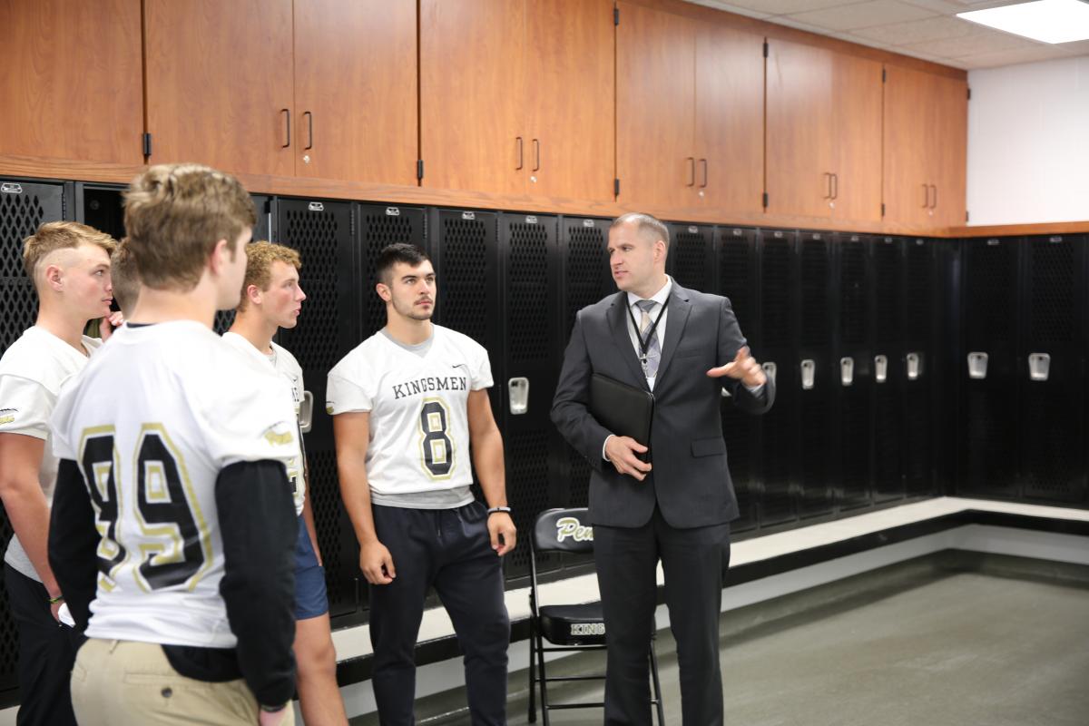 Lenski giving tour of new Kingsmen Athletic Center to football players