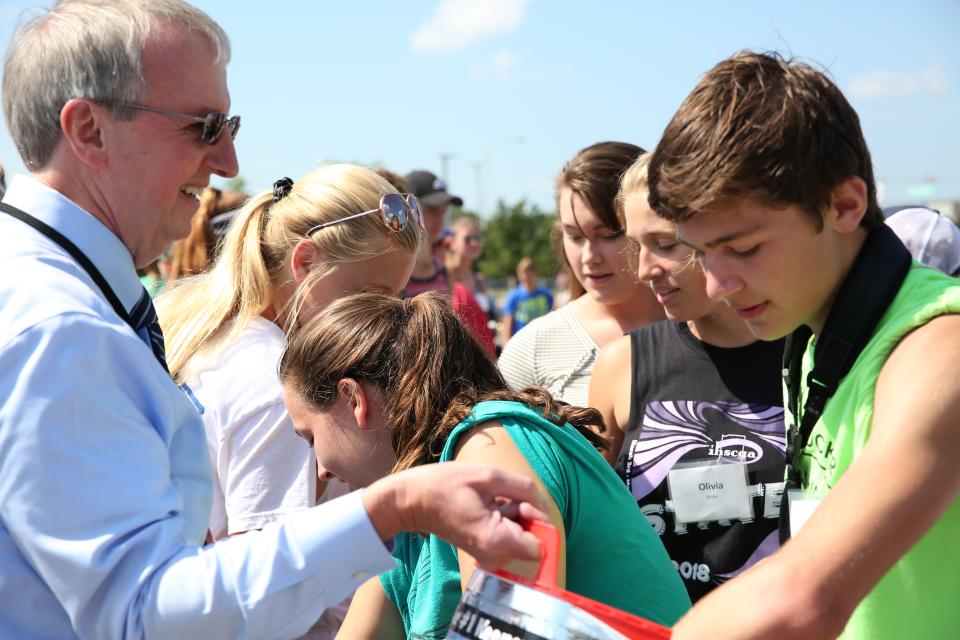 Dr. Thacker handing out popsicles