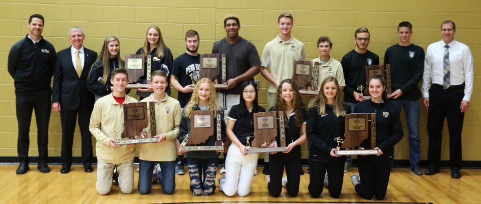 Penn is the only school in the state to win Sectional Championships in all eight IHSAA Fall Sports. Front row (from left), Chad Piatt, Curtis Cornell (BXC), Dani Spring (GXC), Lyvia Li, Abbey Hamilton (GGOLF), Kristina Lynch, Molly McLaughlin (GSOC); back row, Principal Sean Galiher, P-H-M Supt. Dr. Jerry Thacker, Rachel Hickey, Italia Fields (VB), Gabe Yeoman, Carrington Neal (FB), Eric Spaargaren, A.J. Antonelli (BTEN), Brandon Stahl, Micah Craig (BSOC), AD Aaron Leniski.