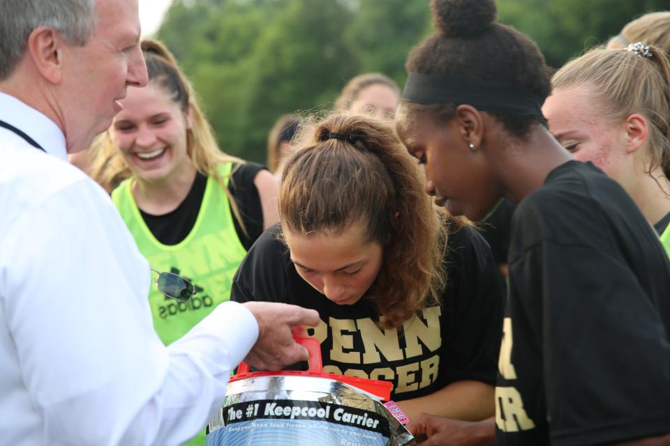 Dr. Thacker handing out popsicles