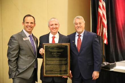 Dr. Thacker receiving his award from IAPSS