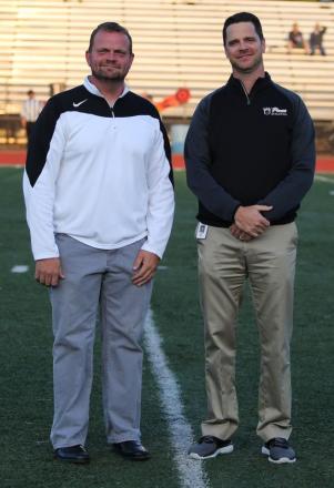 Penn instructor Eric Bowers, left, was recently honored by Penn High School principal Sean Galiher for being named a Fulbright Scholar