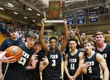 The Penn Boys Basketball celebrates winning the Sectional Championship.